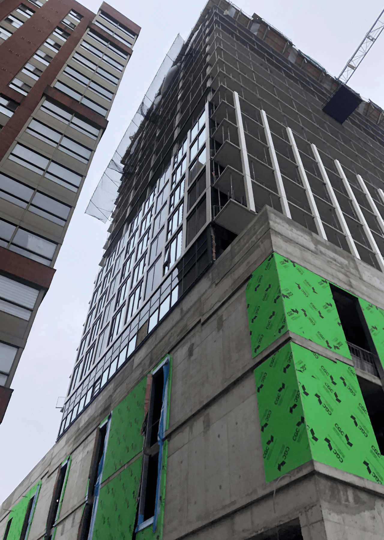 building under construction installing windows